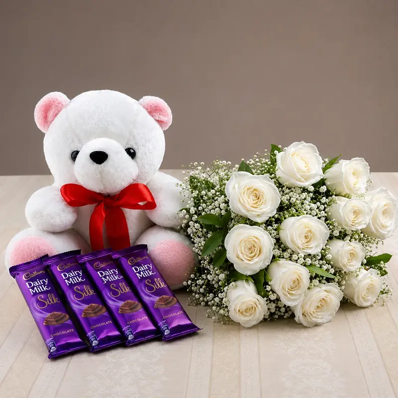 MJflowers white roses with a bear and cadbury silk chocolates