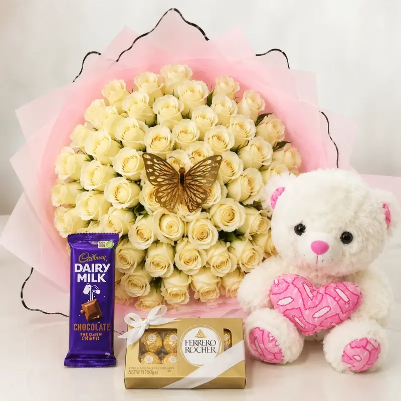 MJflowers white roses with a pink teddy bear and cadbury silk chocolates